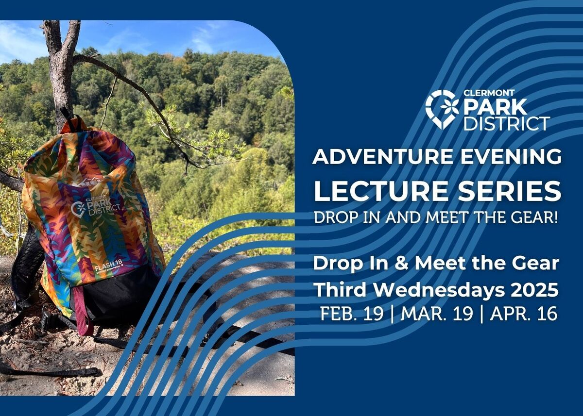 rainbow backpack leaning against a tree on a ledge overlooking a forest